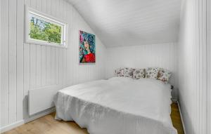 a white bedroom with a bed and a window at 3 Bedroom Stunning Home In Ansager in Ansager