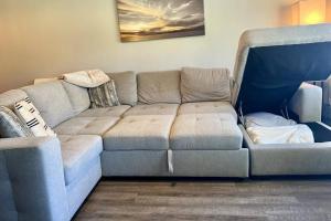 a gray couch in a living room with at Golf & Tennis Community - Lakeview Oasis in Wesley Chapel +42 photos