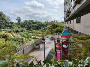 a view of a playground from a building at NEW 6pax 3BR Sunrise view 100m Attractive Places Kea Farm in Cameron Highlands