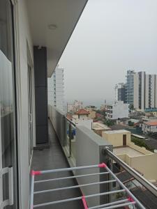 a balcony with stairs and a view of a city at 3 bedroom fully furnished apartment - Vel residencies in Colombo