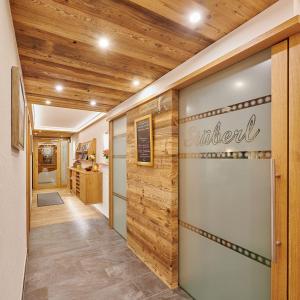 a hallway with a sign on the wall at Gästehaus Sonnenbichl in Berchtesgaden