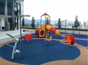 a playground with slides and play equipment in a building at One Majestic Ipoh - 3 Bedroom Apt For Family of 5 in Ipoh