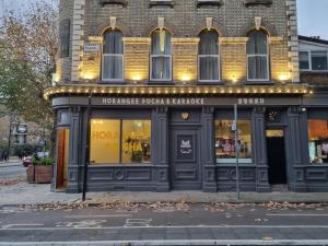 a store on the corner of a street at Horangee Pocha in London