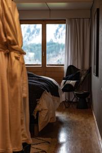 Postel nebo postele na pokoji v ubytování VILLA HUNDERT Boutique Mountainscape
