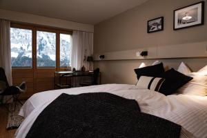 Postel nebo postele na pokoji v ubytování VILLA HUNDERT Boutique Mountainscape