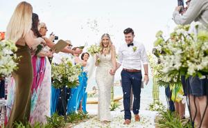 a bride and groom walking down the aisle at their wedding at Zazen Boutique Resort & Spa in Bophut