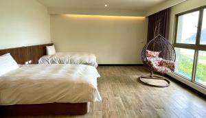 Postel nebo postele na pokoji v ubytování Long Fu Hotel