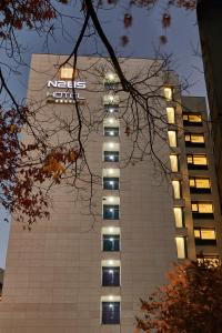 a building with a nedia sign on the side of it at N285 Hotel Insadong in Seoul