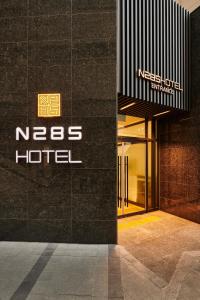 a nes hotel sign on the side of a building at N285 Hotel Insadong in Seoul