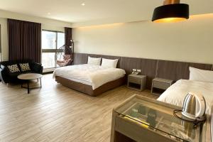 Postel nebo postele na pokoji v ubytování Long Fu Hotel