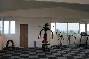 a gym with two treadmills and two elliptical machines at Flamingo Club and Resort Una 3 Km Away from Diu Check Post in Diu