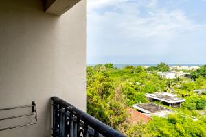 a balcony with a view of a building at MoroccanStyle 4guest Beachfront by น้องมังคุด in Hua Hin