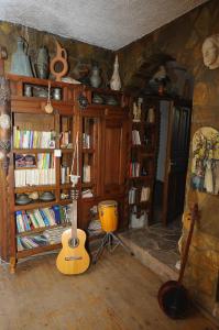 a room with a guitar and a drum in a room at Olympos Koyevi Countryhouse in Olympos