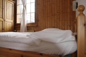 Letto o letti in una camera di Hôtel - Petit-déjeuner Le Trift