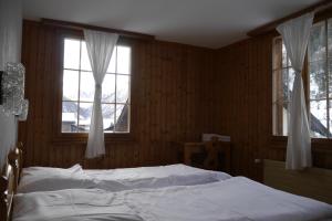 Letto o letti in una camera di Hôtel - Petit-déjeuner Le Trift