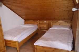 Letto o letti in una camera di Hôtel - Petit-déjeuner Le Trift
