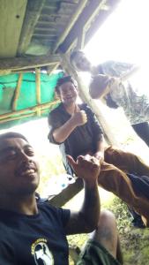 a group of people are sitting in a room at Tegal Jero Homestay in Jatiluwih