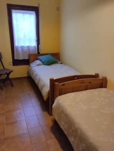 A bed or beds in a room at Casa adossada de camp prop de la Costa Brava