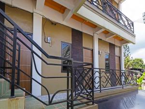 a balcony of a house with a black railing at SPOT ON 91993 Pondok Hs Padalarang Syariah in Padalarang