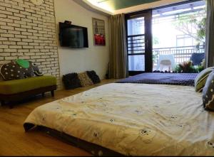 Ένα ή περισσότερα κρεβάτια σε δωμάτιο στο Anping House