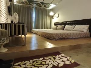 Un pat sau paturi într-o cameră la Anping House