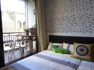 Ένα ή περισσότερα κρεβάτια σε δωμάτιο στο Anping House