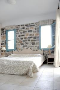 Postel nebo postele na pokoji v ubytování Mohlos Villas