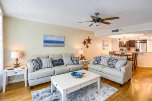 a living room with a couch and a table at 12B Crescent Beach Club in Clearwater Beach