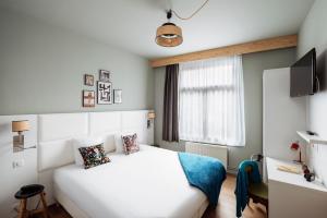 Postel nebo postele na pokoji v ubytování greet hotel Lille Gare Flandres - Groupe Accor