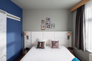 Postel nebo postele na pokoji v ubytování greet hotel Lille Gare Flandres - Groupe Accor