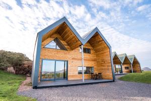 a house with a large angled roof at Lodges at Whitekirk Hill some with Hot Tubs - North Berwick in Whitekirk