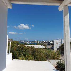 a view of the city from the balcony of a house at Villa Del Mar in Antiparos Town