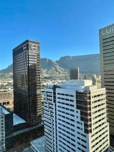 a view of a city with tall buildings at 1728 at One Thibault in Cape Town