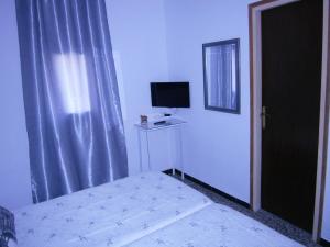 Postel nebo postele na pokoji v ubytování Hostal Don Pepe