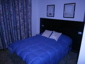 Postel nebo postele na pokoji v ubytování Hostal Don Pepe