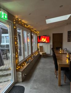 a restaurant with christmas lights on the wall at Hotel zur Wasserburg in Kerpen