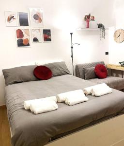 a bed with two pillows on top of it at Milano Holiday & Work House - Duomo in Milan