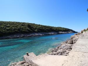 a boat in the water next to a river at Oasis of Paradise in Žrnovo +3 photos
