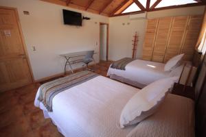 Un pat sau paturi într-o cameră la Hotel El Bramador