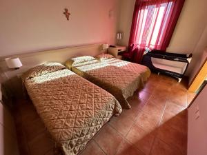 Postel nebo postele na pokoji v ubytování Domus San Bernardino