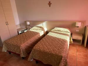Postel nebo postele na pokoji v ubytování Domus San Bernardino