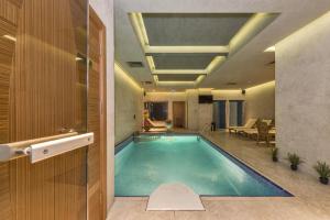 a swimming pool in the middle of a building at The Meretto Hotel Istanbul Old City in Istanbul