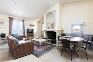 Μια τηλεόραση ή/και κέντρο ψυχαγωγίας στο Appartement Neptune