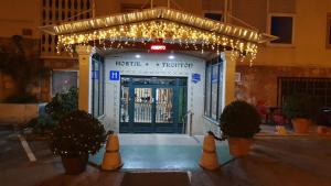 a front door of a building with christmas lights at Hostal Fronton in Alcobendas