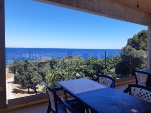 a dining room with a view of the ocean at Camping Mozziconaccio in Sainte-Lucie de Porto-Vecchio
