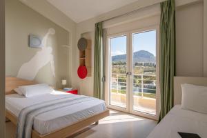 Postel nebo postele na pokoji v ubytování Luxury Villa Alba by Estia