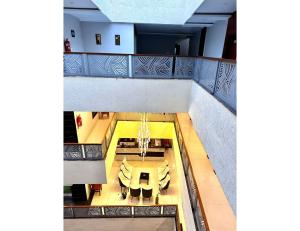 a view of a balcony with a table and chairs at Sagar Regency And Lodge, Bidar in Bīdar