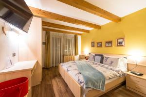Postel nebo postele na pokoji v ubytování Alpstyle Hotel Albolina Wellness & Beauty