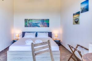 A bed or beds in a room at Seaview Villas Még 37 kép