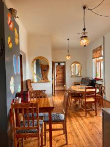 a dining room with a table and chairs at Butterfly House in Pāvilosta